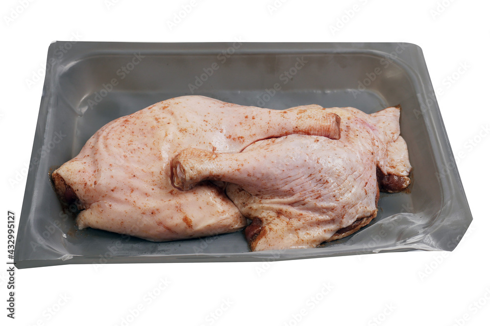 Two raw duck legs on a grey plastic tray vacuumed packed for freshness. Fresh poultry product, meat industry business Two raw duck legs on a grey plastic tray vacuumed packed for freshness. Fresh poultry product, meat industry business