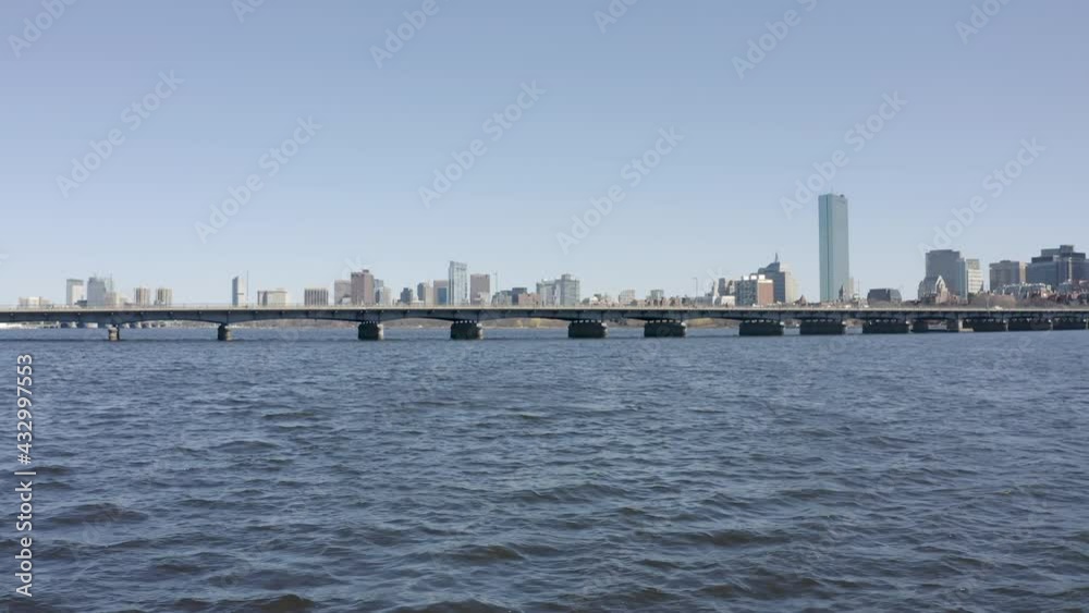 Harvard Bridge against Boston skyline. Low angle fast aerial forward Harvard Bridge against Boston skyline. Low angle fast aerial forward