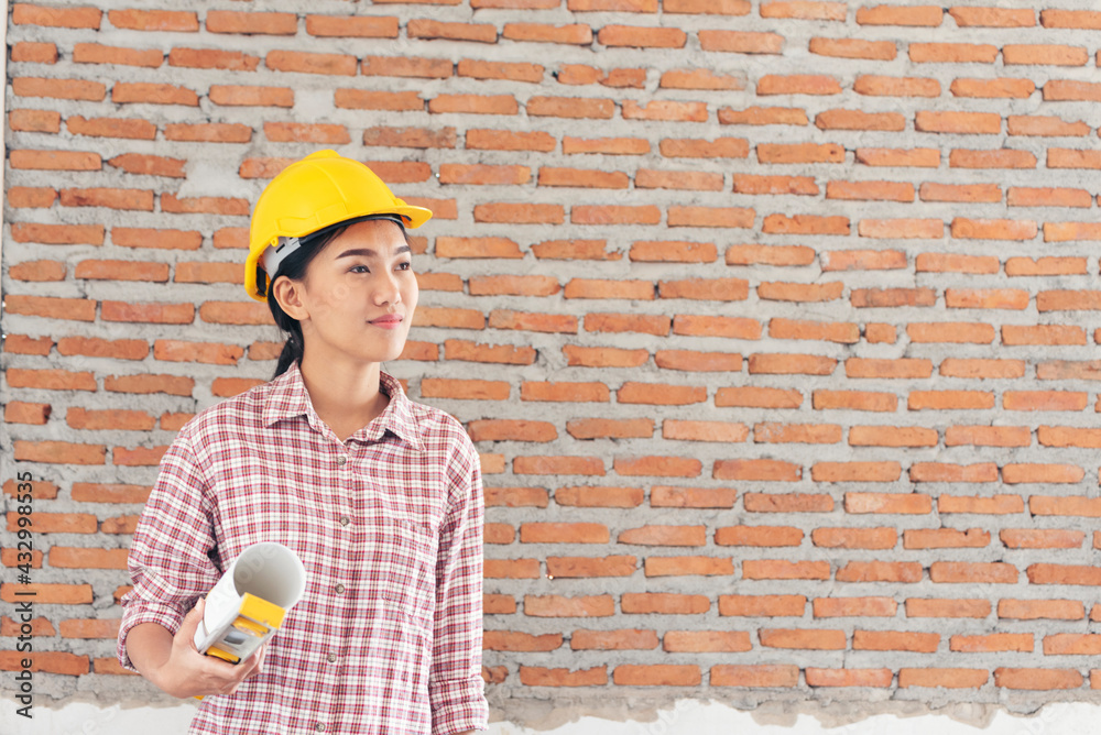Woman construction engineer wear safety white hard hat at construction site industry worker. Female engineer worker civil engineering with hard hat safety helmet. Woman construction Engineer concept Woman construction engineer wear safety white hard hat at construction site industry worker. Female engineer worker civil engineering with hard hat safety helmet. Woman construction Engineer concept