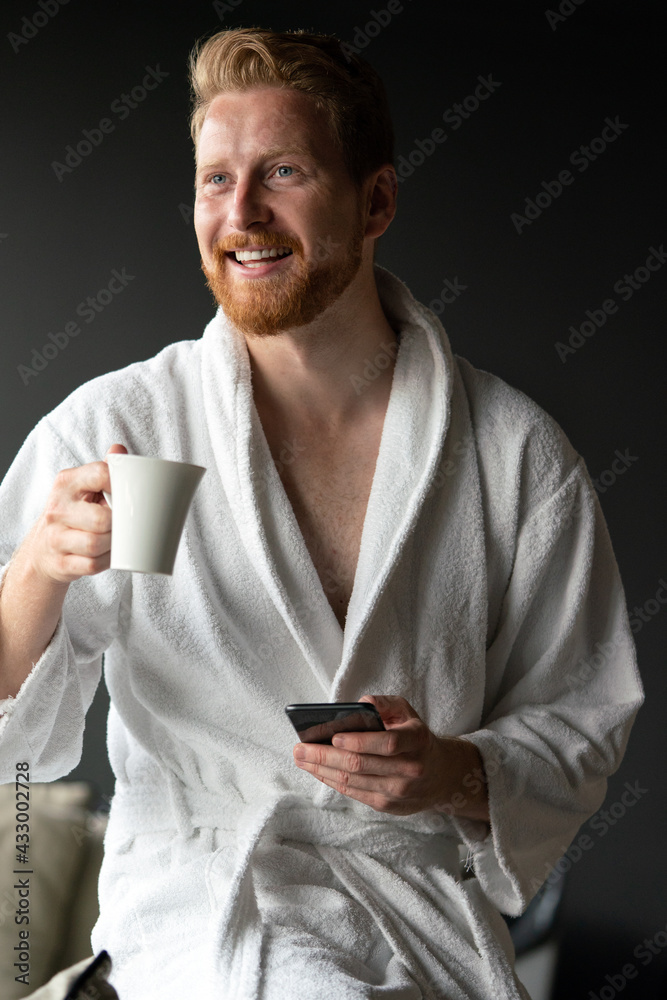 Young man drinking coffee in the morning at hotel, spa Young man drinking coffee in the morning at hotel, spa