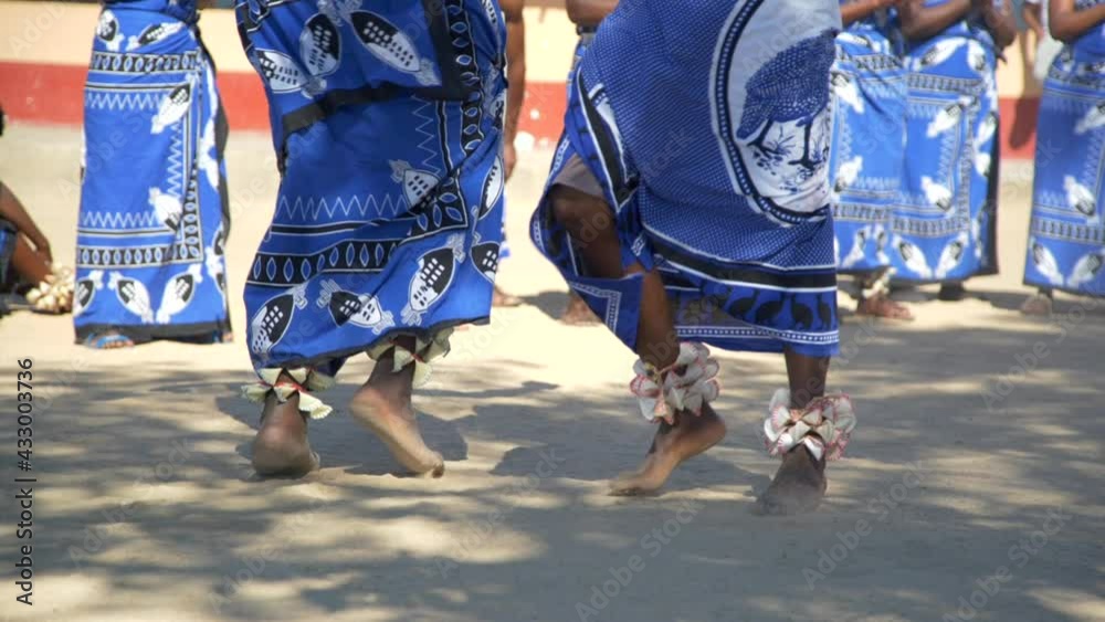 Feet of African tribe members performing ceremonial dance, slow motion