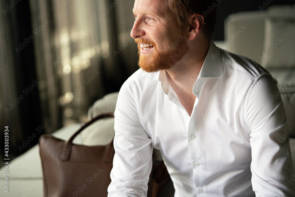 Obraz premium Portrait of a handsome young businessman smiling