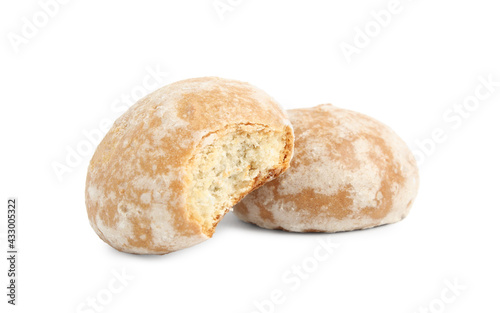 Tasty bitten and whole gingerbread cookies on white background