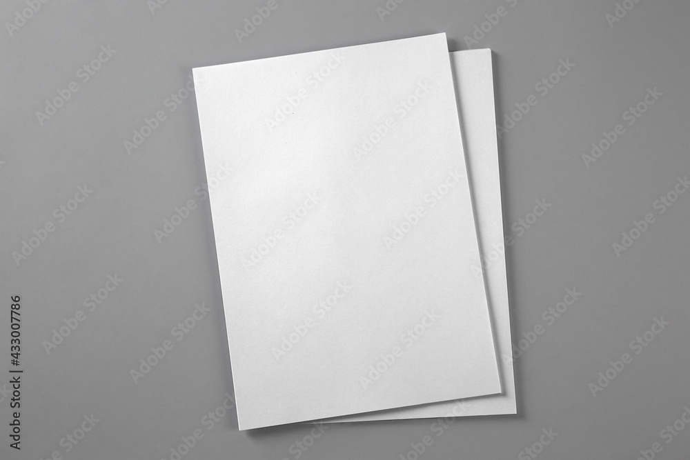 Blank brochures on grey background, top view. Mockup for design Blank brochures on grey background, top view. Mockup for design