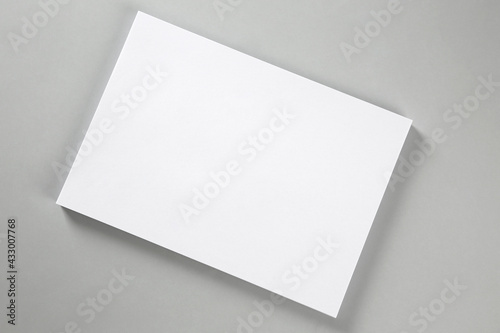 Blank brochure on grey background, top view. Mockup for design