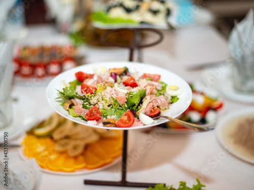 Tasty seafood salad with vegetables mix on table