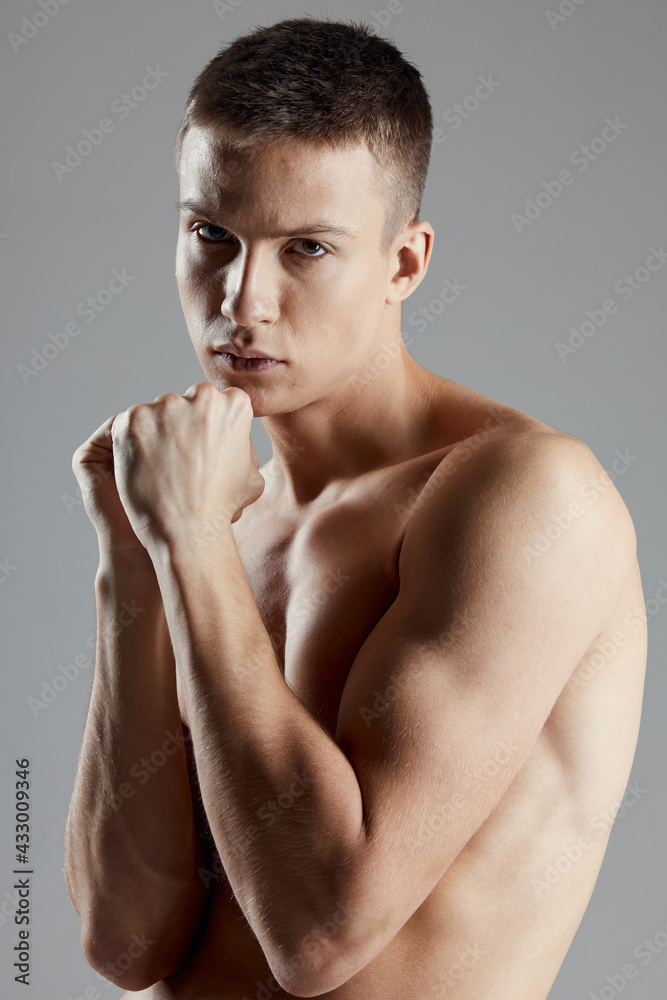 boxer with fist on gray background closeup portrait cropped view boxer with fist on gray background closeup portrait cropped view
