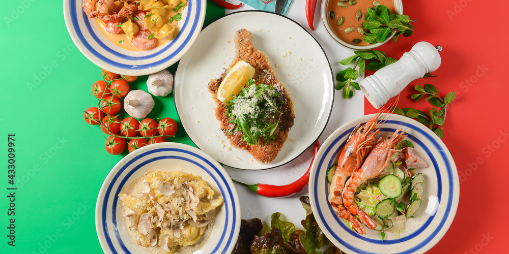 Italian food on Italian flag background, top view, flat lay. Pasta, shrimps, cream soup with pumpkin seeds. Italian food on Italian flag background, top view, flat lay. Pasta, shrimps, cream soup with pumpkin seeds.