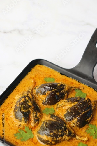 Baghare baingan, Baingan masala, Eggplant or brinjal curry, Bharli vangi. Khare vanga served in pan. Copy space.