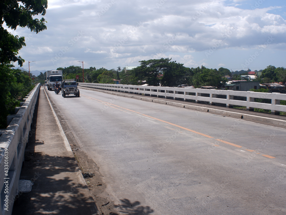 Affordable and cheap short-span concrete river bridge in the Philippine countryside.