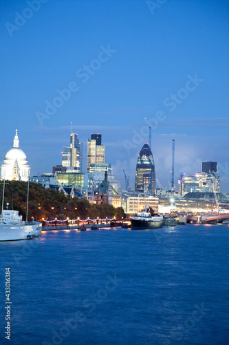Portrait crop view of St Pauls and the London skyline of the River Thames in the foreground