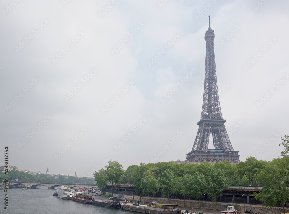 Fototapeta premium View of the Port de Suffren and the Eiffel Tower. In the port there are ships and cars
