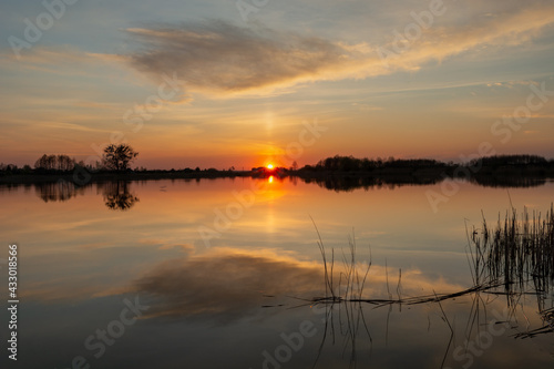Reflection of cloud in a calm lake at sunset  Stankow  Poland
