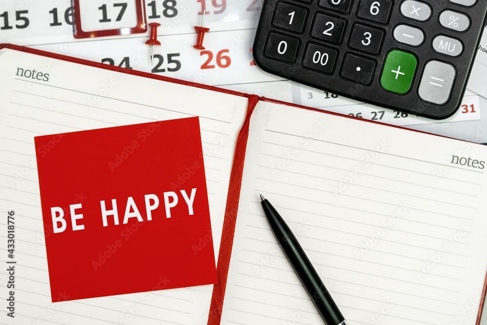 Be happy - concept of text on sticky note. Work and study concept Be happy - concept of text on sticky note. Work and study concept
