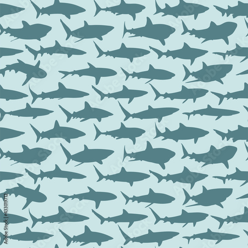 The seamless blue background with sharks.