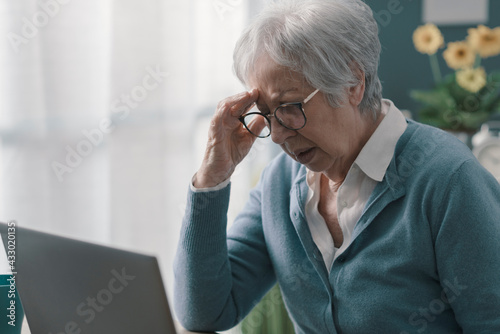 Senior woman having a bad headache