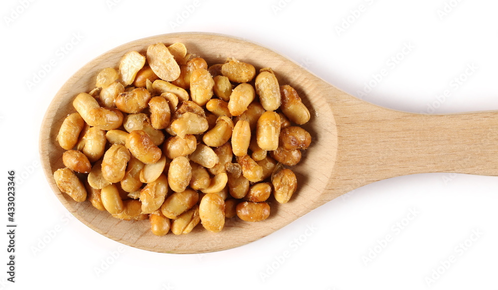 Roasted soybeans in wooden spoon isolated on white background, top view Roasted soybeans in wooden spoon isolated on white background, top view