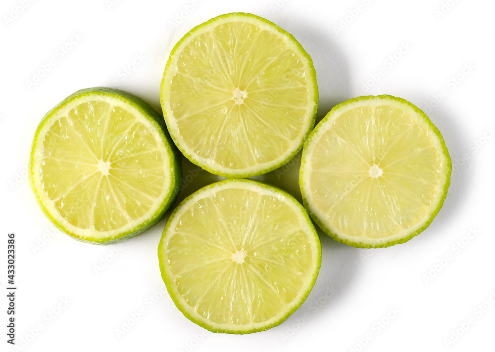 Sliced lime pieces, halves isolated on white background, top view Sliced lime pieces, halves isolated on white background, top view