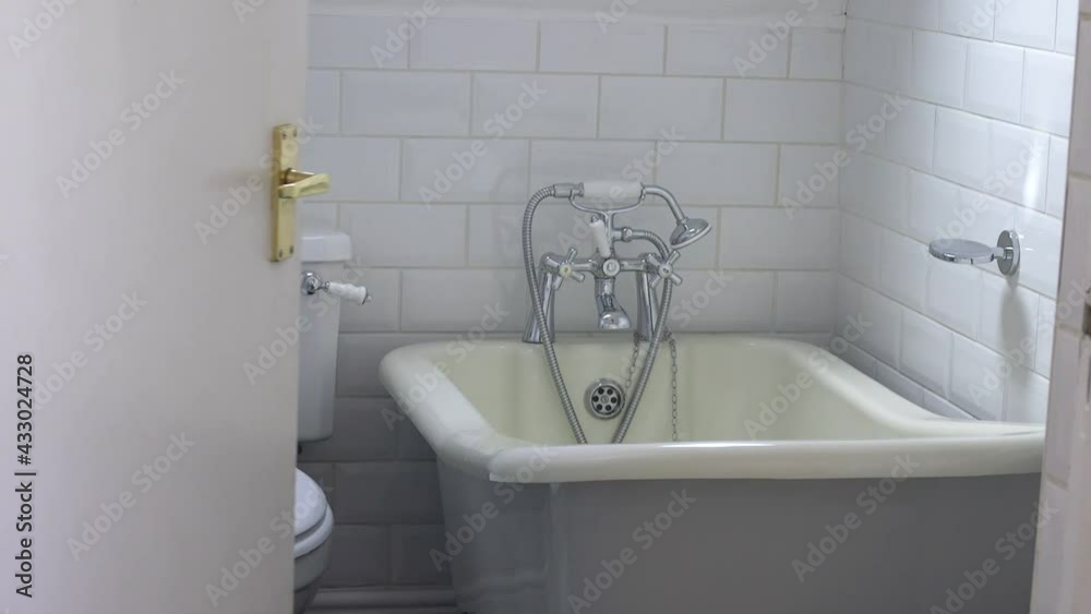 Door opens into a traditional British bathroom