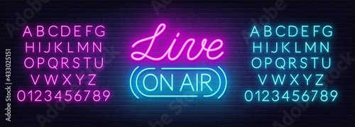 Live on air neon sign on a brick wall background.
