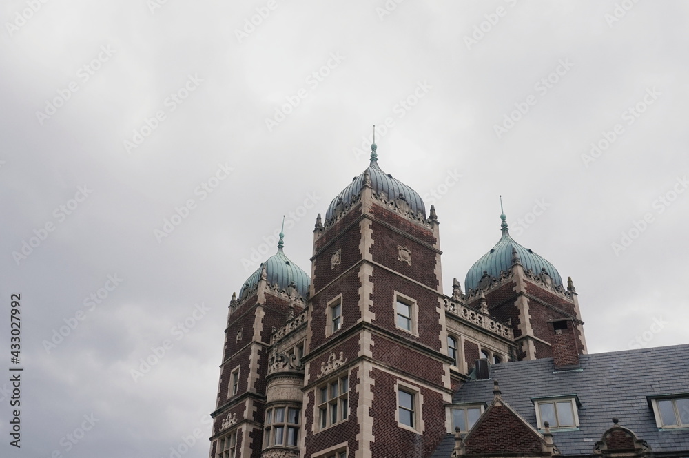 Ornate Domed Brick Building Roof Against Overcast Clouded Daylight Sky