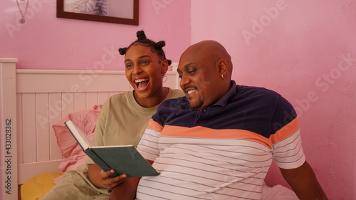 Portrait of Father and Daughter Reading a Novel