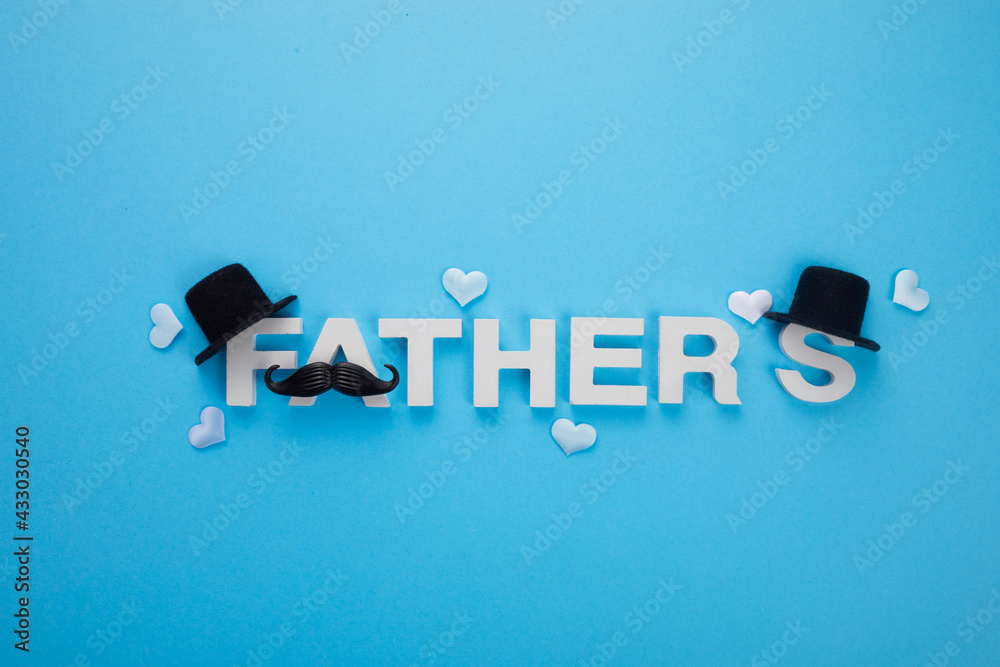 Father's Day banner with mustache and hats on blue background Father's Day banner with mustache and hats on blue background