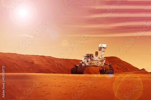 Fototapeta Naklejka Na Ścianę i Meble -  Mars rover on the surface of the planet Mars. Elements of this image were furnished by NASA.