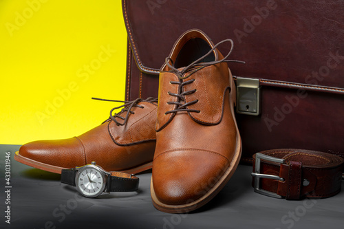 Collection of men's accessories. Men's shoes, belt, watch and briefcase. Mens accessories background.