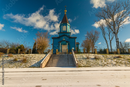 historic blue church in winter photo