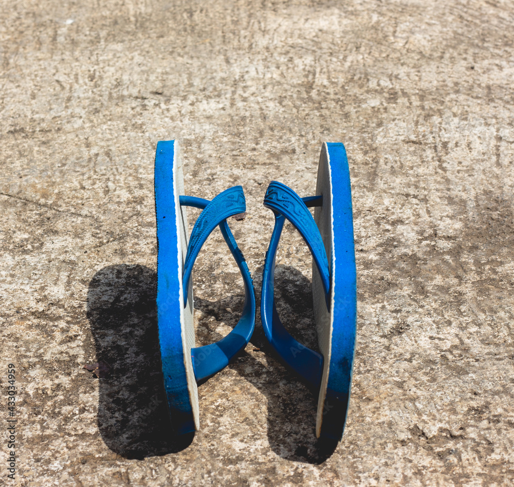 flip-flops in blue, white and black with a classic design. very good for products, business and creativity ideas. flip-flops in blue, white and black with a classic design. very good for products, business and creativity ideas.