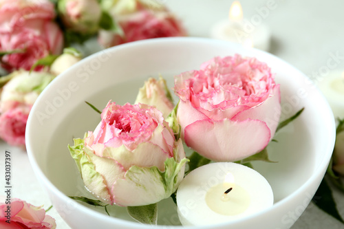 Romantic concept with roses and candles, close up