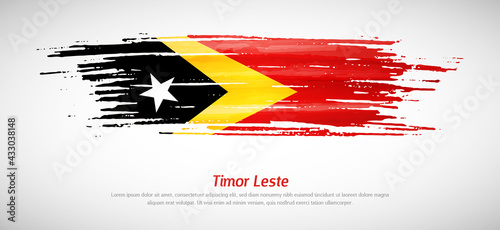 Artistic grungy watercolor brush flag of Timor Leste country. Happy national day background