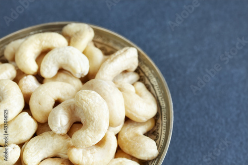 Cashew nuts in a bowl, selective focus, space for text.