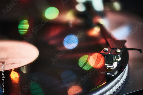 Close-Up Of Turntable Against Illuminated Lights