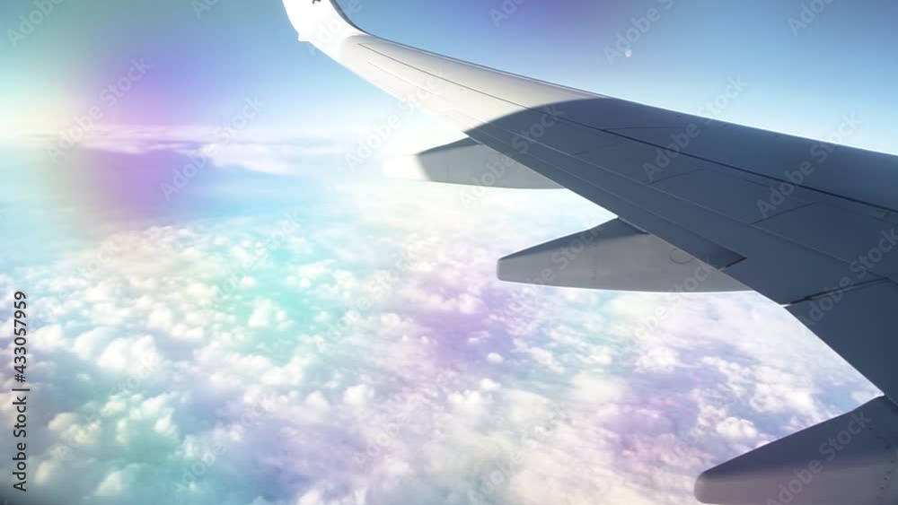 Clouds under moving airplane watched from window (Cinematic camera movement) Clouds under moving airplane watched from window (Cinematic camera movement)