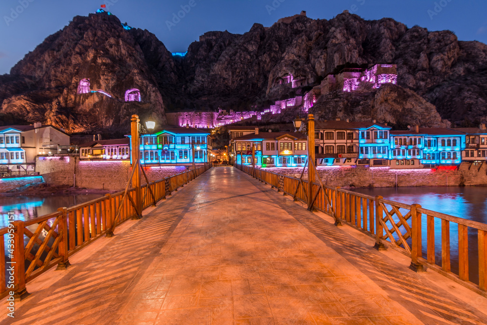 Old Ottoman houses night panoramic view by the Yesilirmak River in Amasya City. Amasya is populer tourist destination in Turkey.