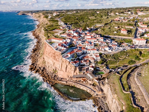 Aerial view of Azenhas do Mar, a small township along the wild Portuguese coastline facing the Atlantic Ocean, Colares, Portugal.