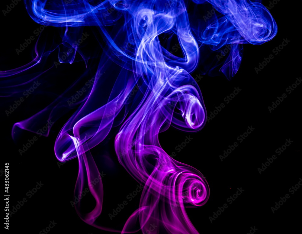 Obraz premium Colored smoke on black background