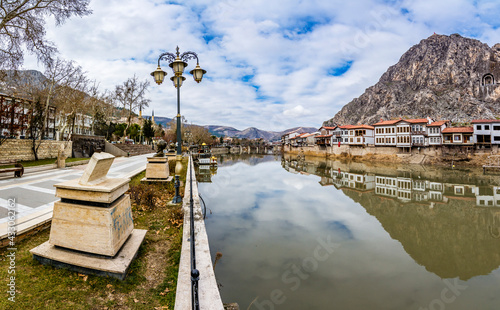 Old Ottoman houses evening panoramic view by the Yesilirmak River in Amasya City. Amasya is populer tourist destination in Turkey. photo