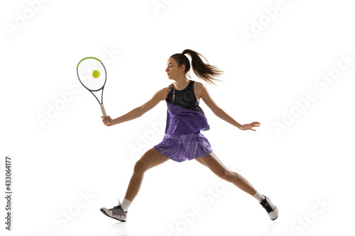 Young caucasian woman playing tennis isolated on white studio background in action and motion, sport concept © master1305