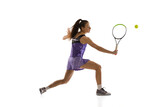 Young caucasian woman playing tennis isolated on white studio background in action and motion, sport concept