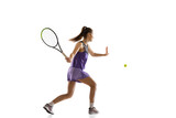 Young caucasian woman playing tennis isolated on white studio background in action and motion, sport concept