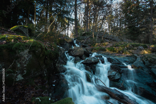 Fototapeta Naklejka Na Ścianę i Meble -  Long exposure photo of a beautiful waterfall in the Swedish forest.