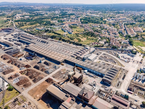 Aerial view of a giant quarry and construction site at Ecometais, a Treatment and recycling plant in Aldeia de Paio Pires industrial area, Setubal, Portugal.