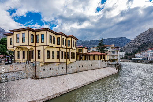 Old Ottoman houses evening panoramic view by the Yesilirmak River in Amasya City. Amasya is populer tourist destination in Turkey.