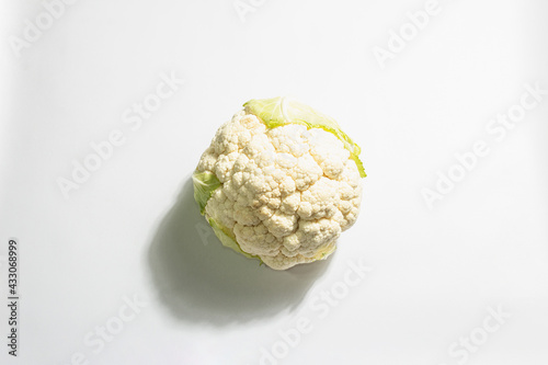 A fresh head of cauliflower isolated on white background