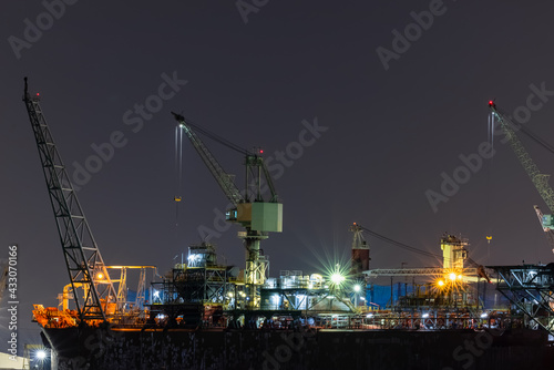 Ship Maintenance in Dry Dock at Night