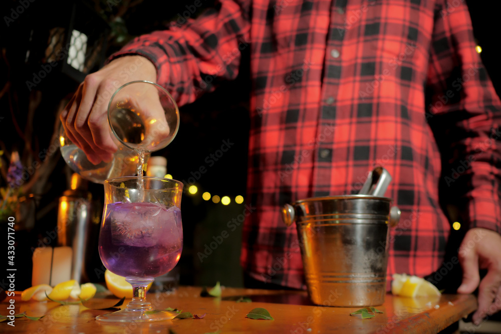 Man preparing drink with lemon