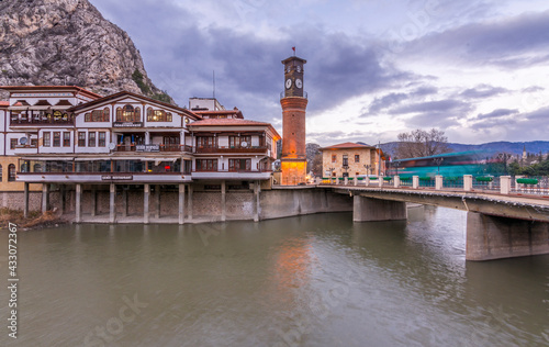 Old Ottoman houses evening panoramic view by the Yesilirmak River in Amasya City. Amasya is populer tourist destination in Turkey. photo